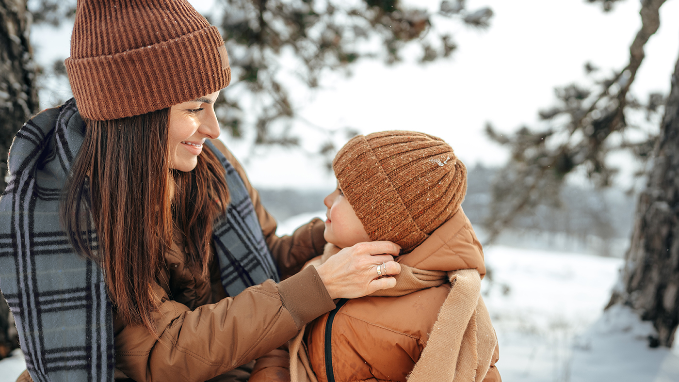mom with son outside in the cold winter air