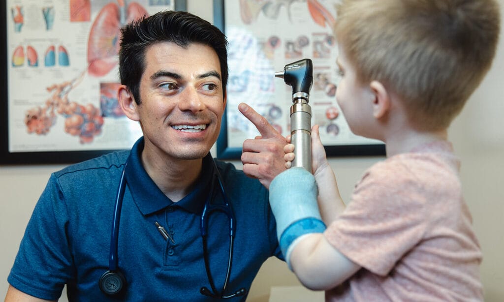 Jacob Juarez, PA-C exam with a young patient