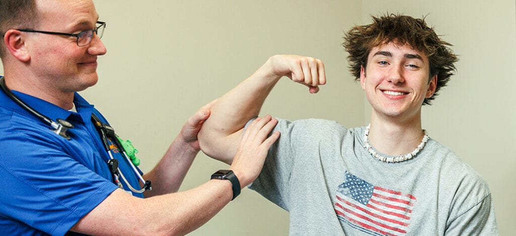 Isaac Marshall, MD with a teen patient.