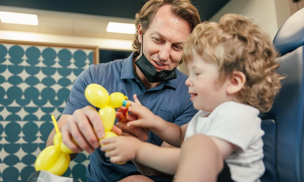 Chris Neeley, DDS with a toddler patient