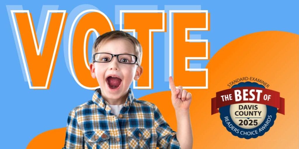 young boy in glasses smiling excitedly on a blue and orange background with a Best of Davis County voting badge