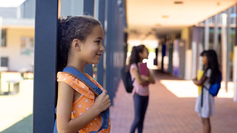 Young girl standing outside the middle school