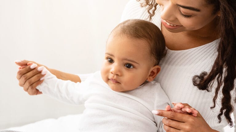 mom holding baby in the doctor's office