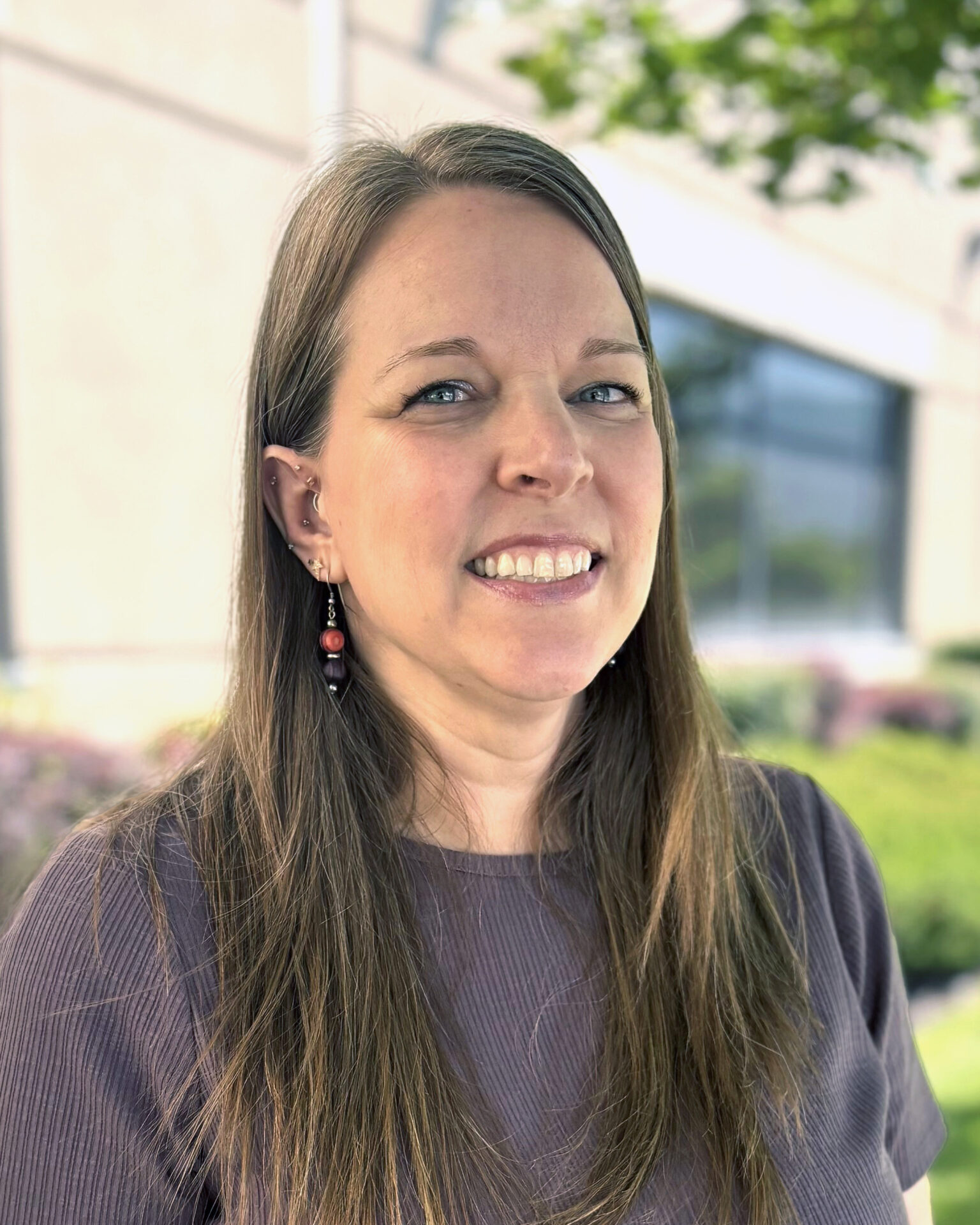 headshot of Vicki VanDenBerghe outside the office
