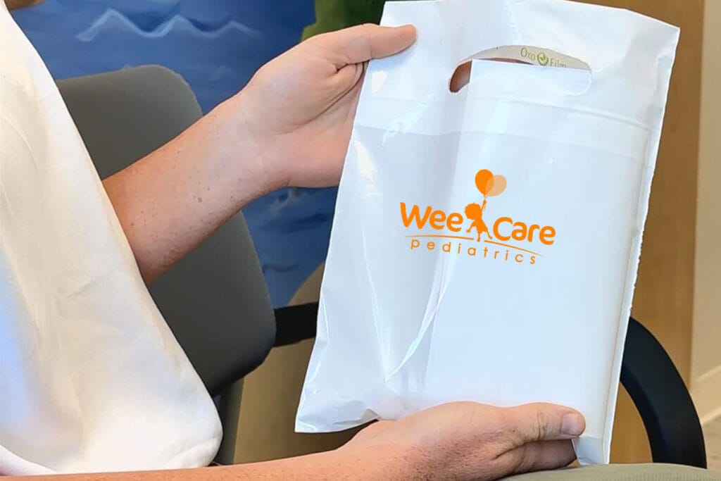 Mother holding a bag with her child's prescription