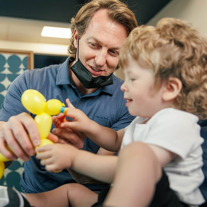 Pediatric Dentist and a happy toddler