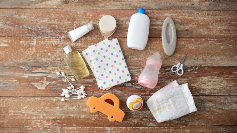 Flat lay of newborn essential items