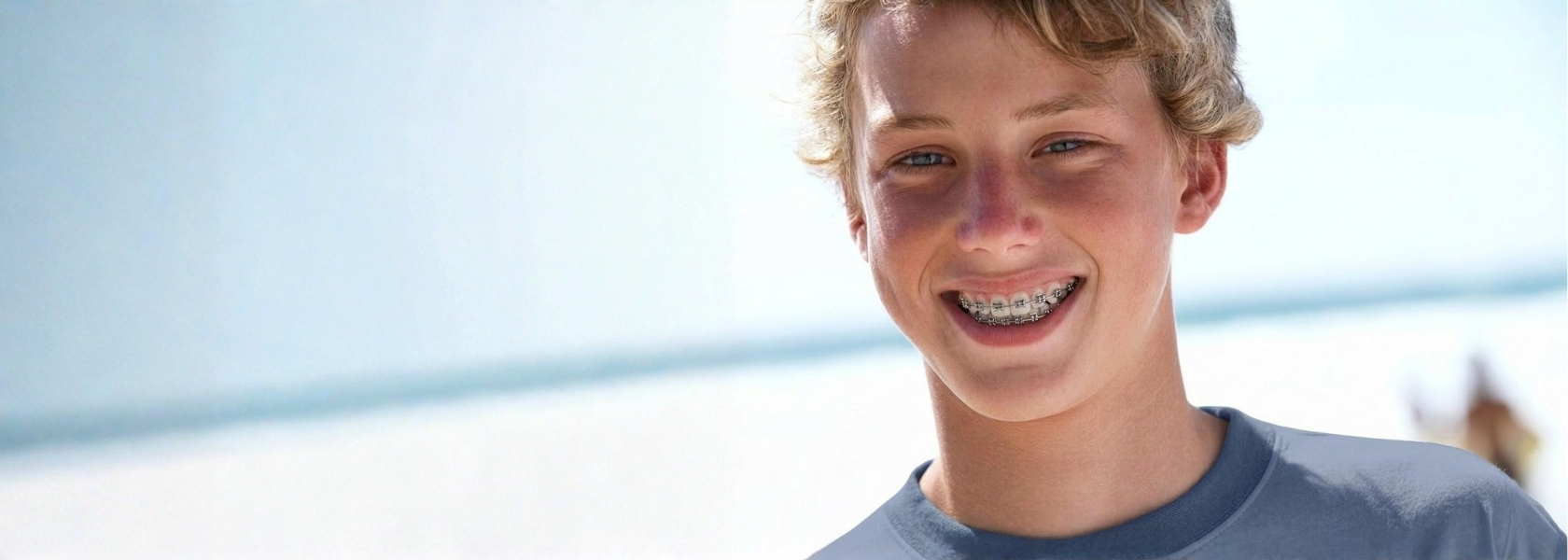 young boy smiling with braces