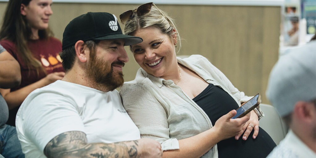 Happy couple smiling in class.