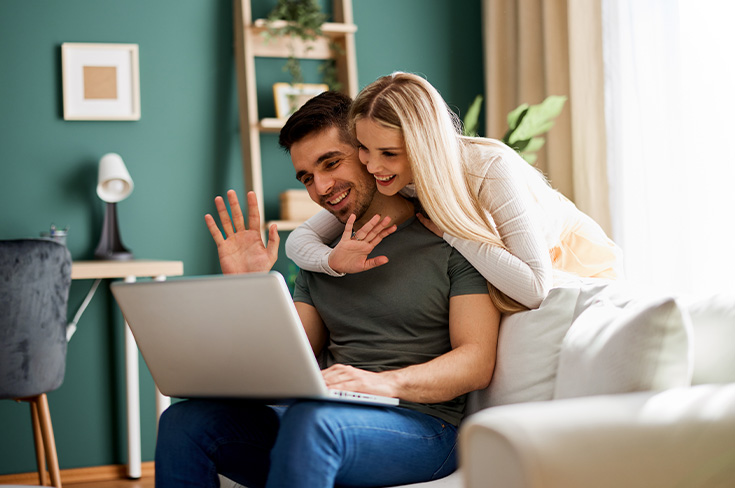 Young couple on virtual meeting at home