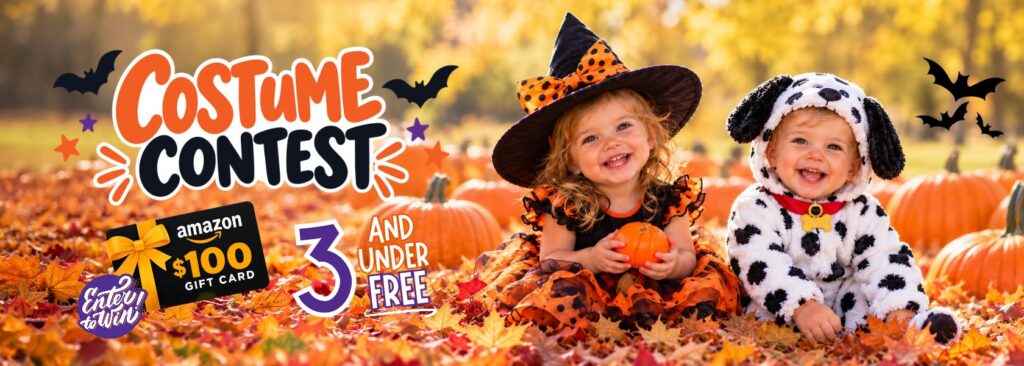 two young kids in Halloween costumes in pumpkin patch